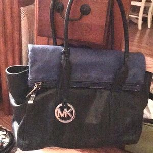 Michael Kors fold over hand bag black on cobalt blue or black on black